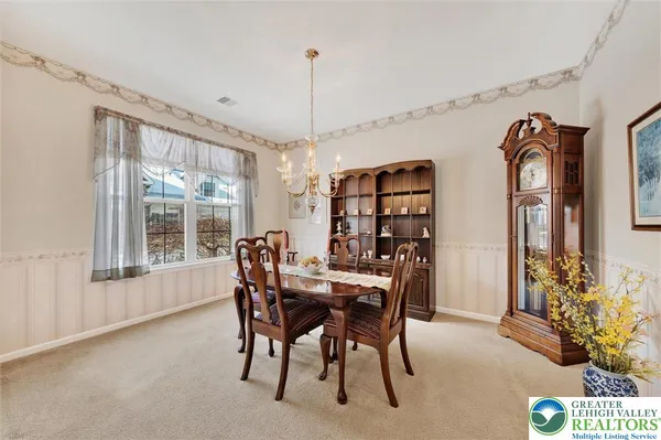 a view of a dining room with furniture window and outside view