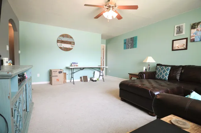 a living room with furniture and a window