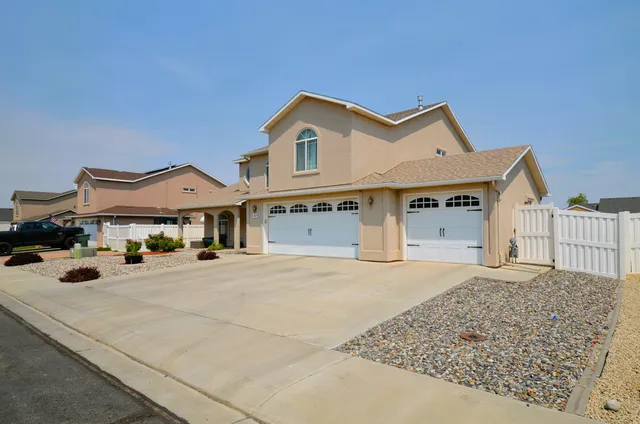 a view of a white house with a outdoor space