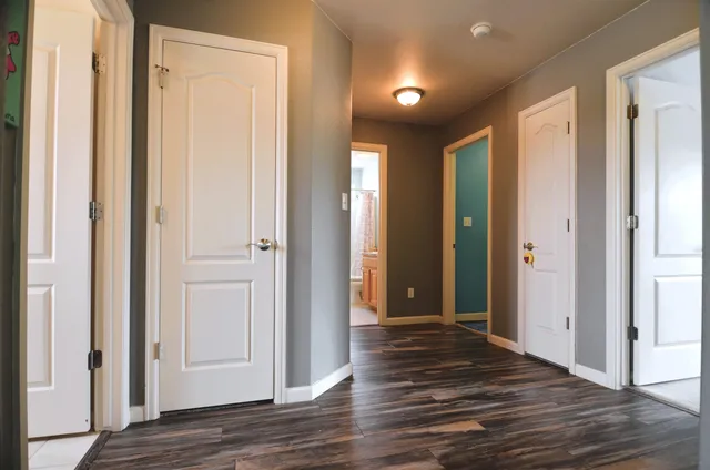 a bedroom with a bed and a ceiling fan