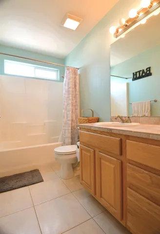 a bed room with furniture and window