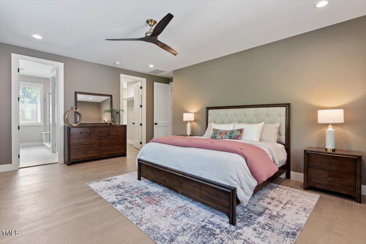 337 Merrywood Drive Raleigh, NC 27610 - Photo 22 of 52 a bedroom with a bed and mirror