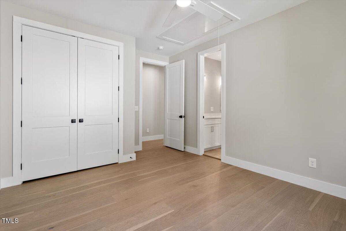 337 Merrywood Drive Raleigh, NC 27610 - Photo 27 of 52 a view of an empty room with wooden floor