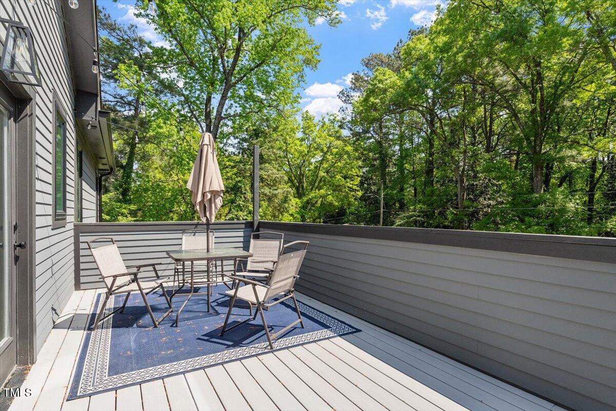 337 Merrywood Drive Raleigh, NC 27610 - Photo 36 of 52 a view of balcony with chairs and wooden fence