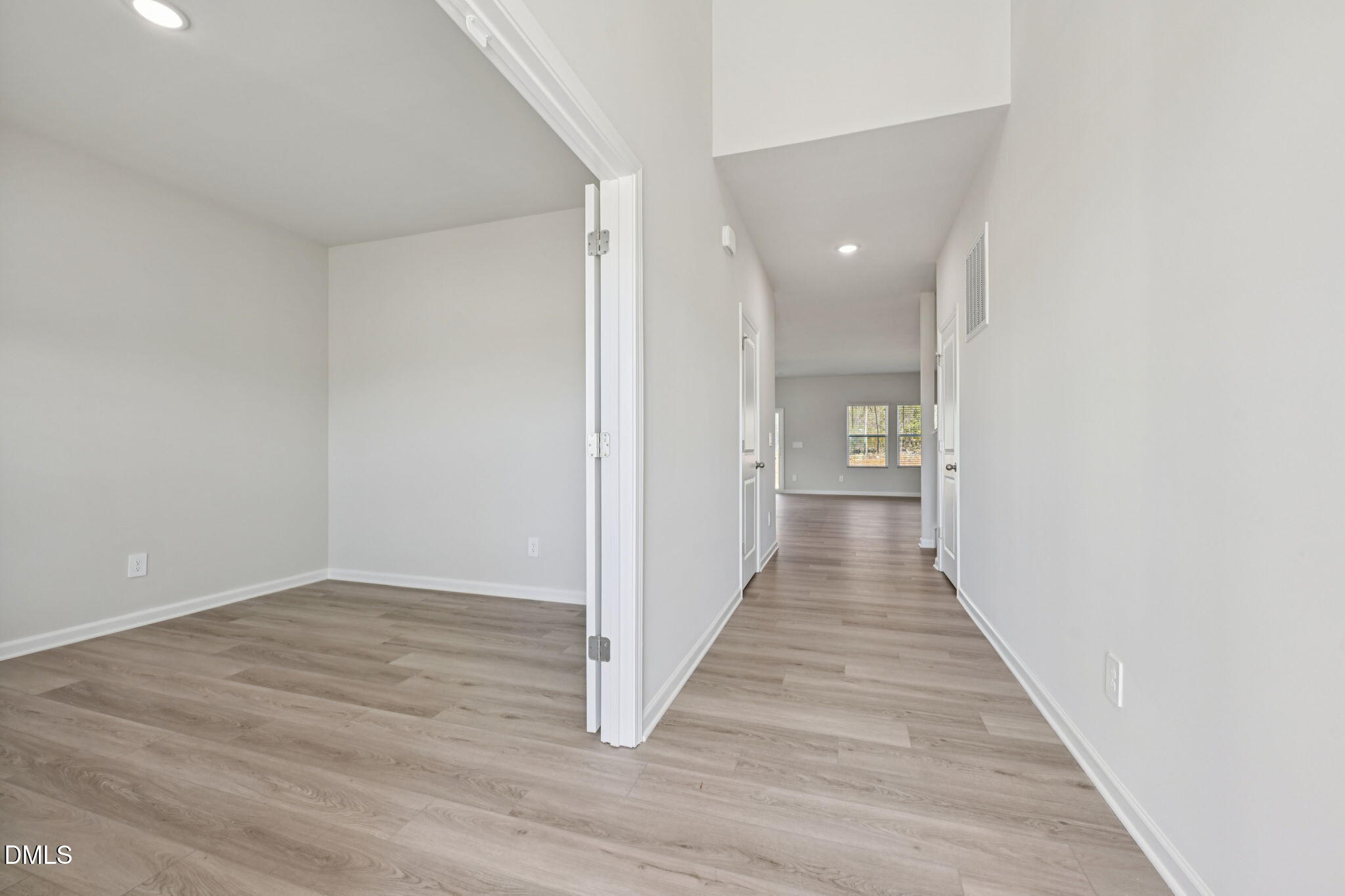 2145 Topsail Road Durham, NC 27703 - Photo 16 of 49 a view of a hallway with wooden floor