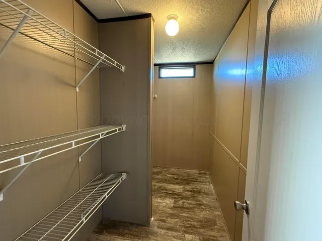 a view of a house with a wooden deck