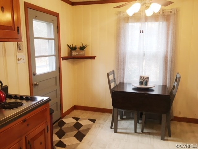 9717 Kingman Road Chesterfield, VA 23236 - Photo 3 of 13 a view of a workspace with furniture and a window