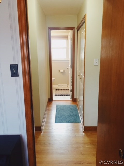 9717 Kingman Road Chesterfield, VA 23236 - Photo 7 of 13 a view of a hallway with wooden floor