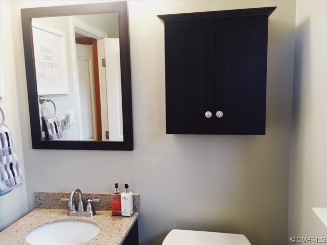 9717 Kingman Road Chesterfield, VA 23236 - Photo 9 of 13 a bathroom with a sink and a toilet
