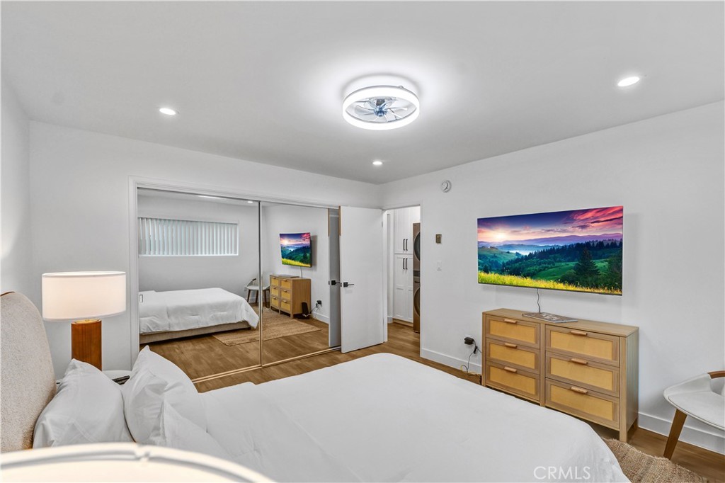 4354 Oakwood Avenue Los Angeles, CA 90004 - Photo 14 of 17 a bedroom with a bed and a flat screen tv