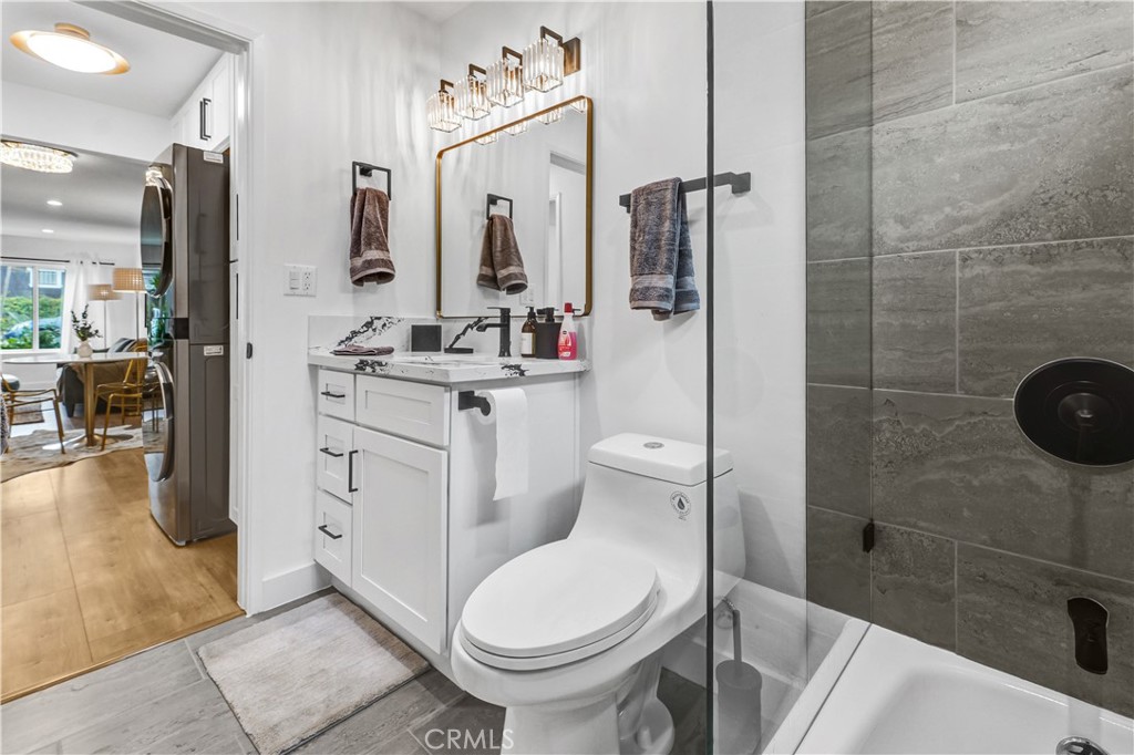 4354 Oakwood Avenue Los Angeles, CA 90004 - Photo 16 of 17 a bathroom with a sink toilet and shower