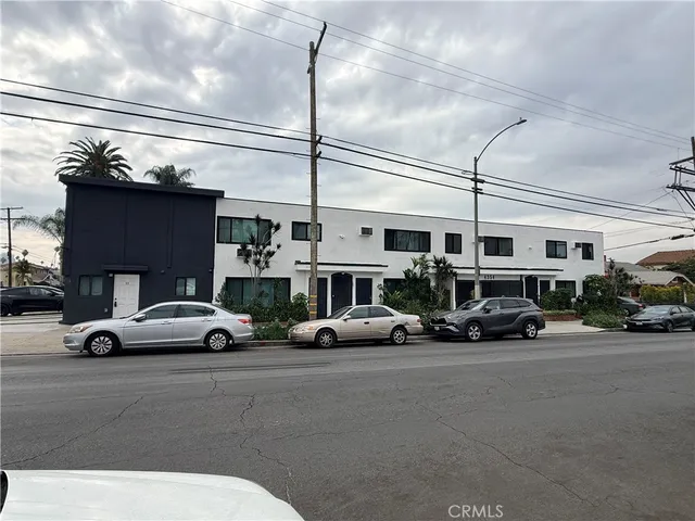 a view of a cars parked in front of a building