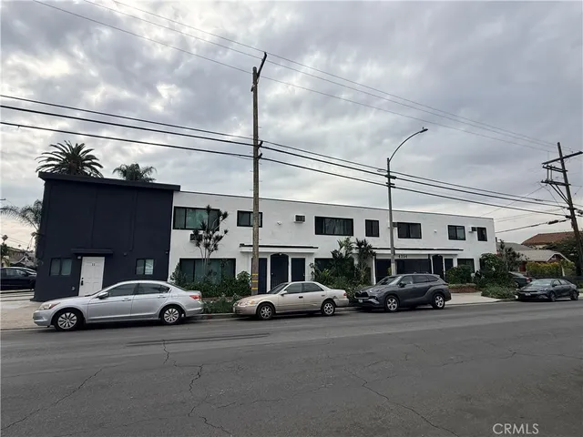 a view of a cars parked in front of a building