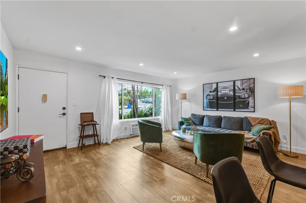 4354 Oakwood Avenue Los Angeles, CA 90004 - Photo 4 of 17 a living room with furniture and a window