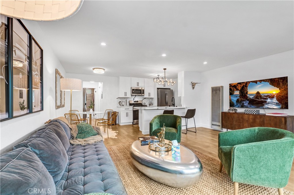 4354 Oakwood Avenue Los Angeles, CA 90004 - Photo 5 of 17 a living room with furniture and a flat screen tv