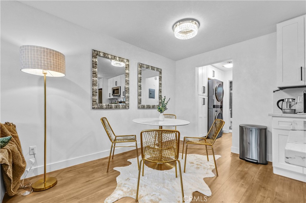 4354 Oakwood Avenue Los Angeles, CA 90004 - Photo 7 of 17 a view of a dining room with furniture and wooden floor