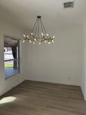 a view of a chandelier fan in a room