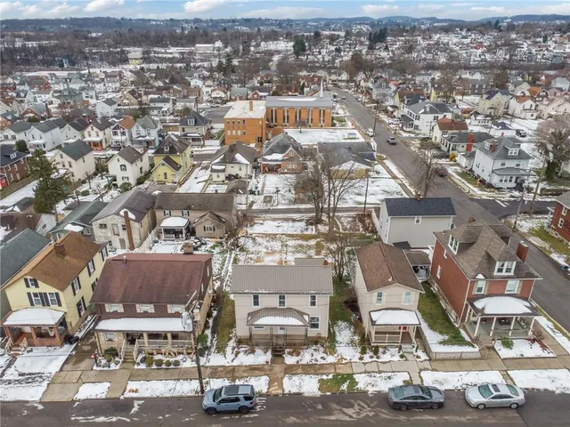 an aerial view of a city with streets and houses