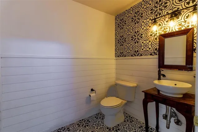 a bathroom with a toilet and sink