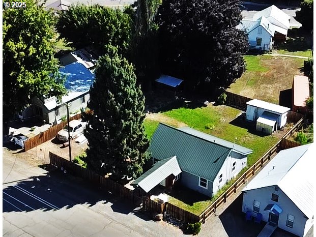 an aerial view of house with yard