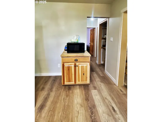 a kitchen with a sink and a refrigerator