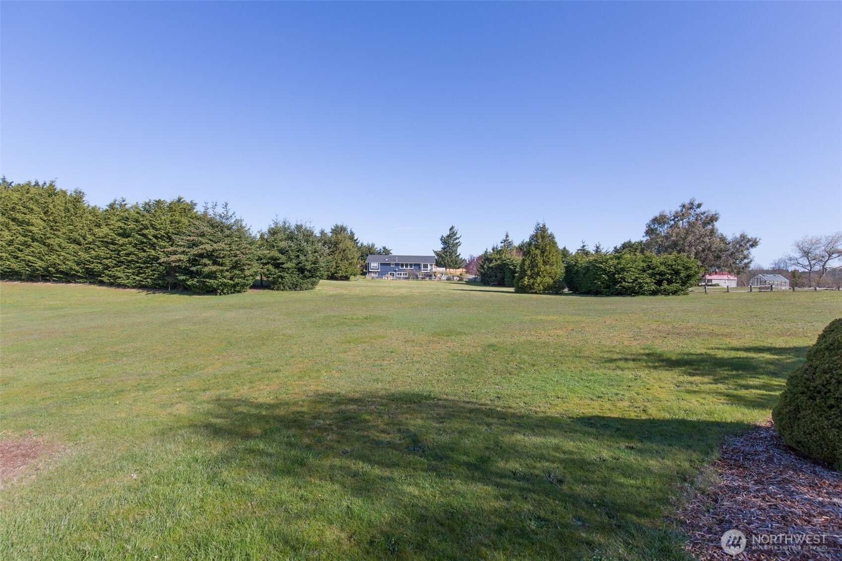 81 Bon Jon View Way Sequim, WA 98382 - Photo 8 of 38 a view of a lake with houses in the back