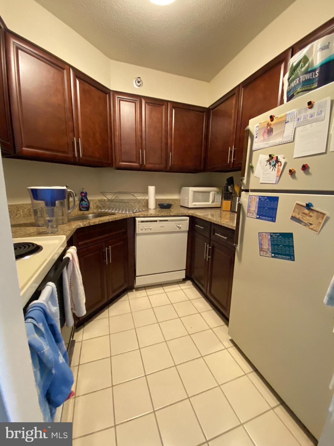 2020 Walnut Street, Unit 10A Philadelphia, PA 19103 - Photo 2 of 15 a kitchen with a cabinets a sink and a counter top space
