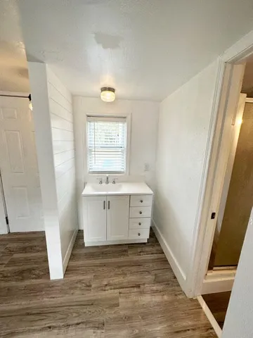 a view of a bathroom with sink and mirror