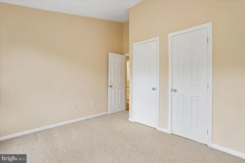 a bedroom with furniture and a flat screen tv