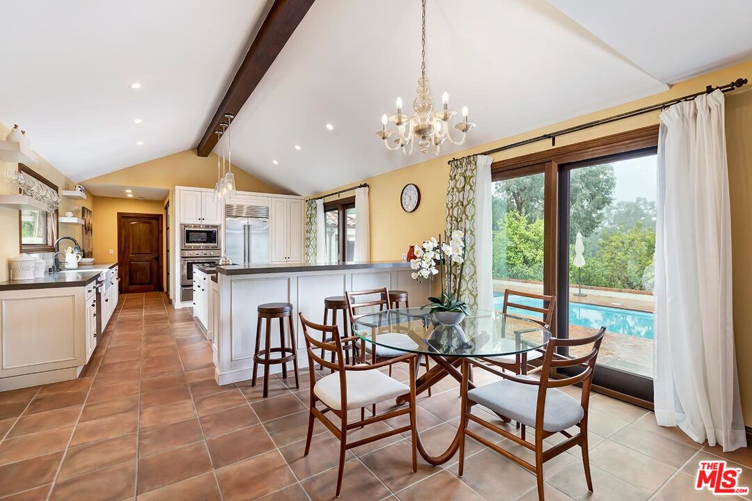 13146 Rivers Road Los Angeles, CA 90049 - Photo 13 of 38 a view of a dining room with furniture window and outside view