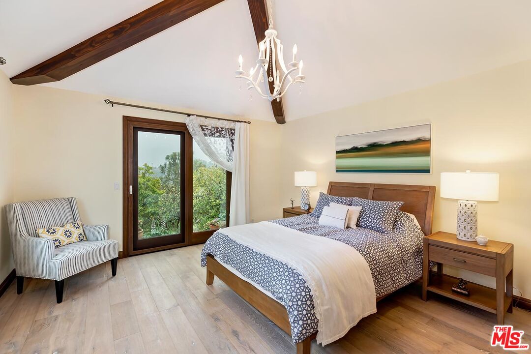 13146 Rivers Road Los Angeles, CA 90049 - Photo 14 of 38 a bedroom with a bed and a couch