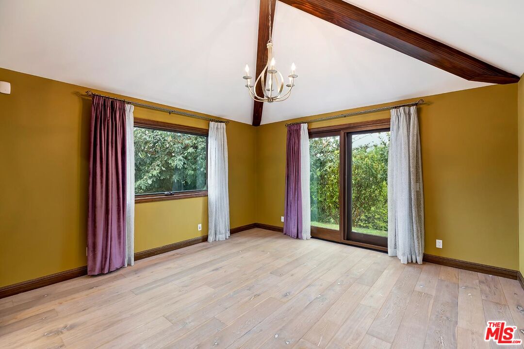 13146 Rivers Road Los Angeles, CA 90049 - Photo 17 of 38 a view of a room with window wooden floor and door