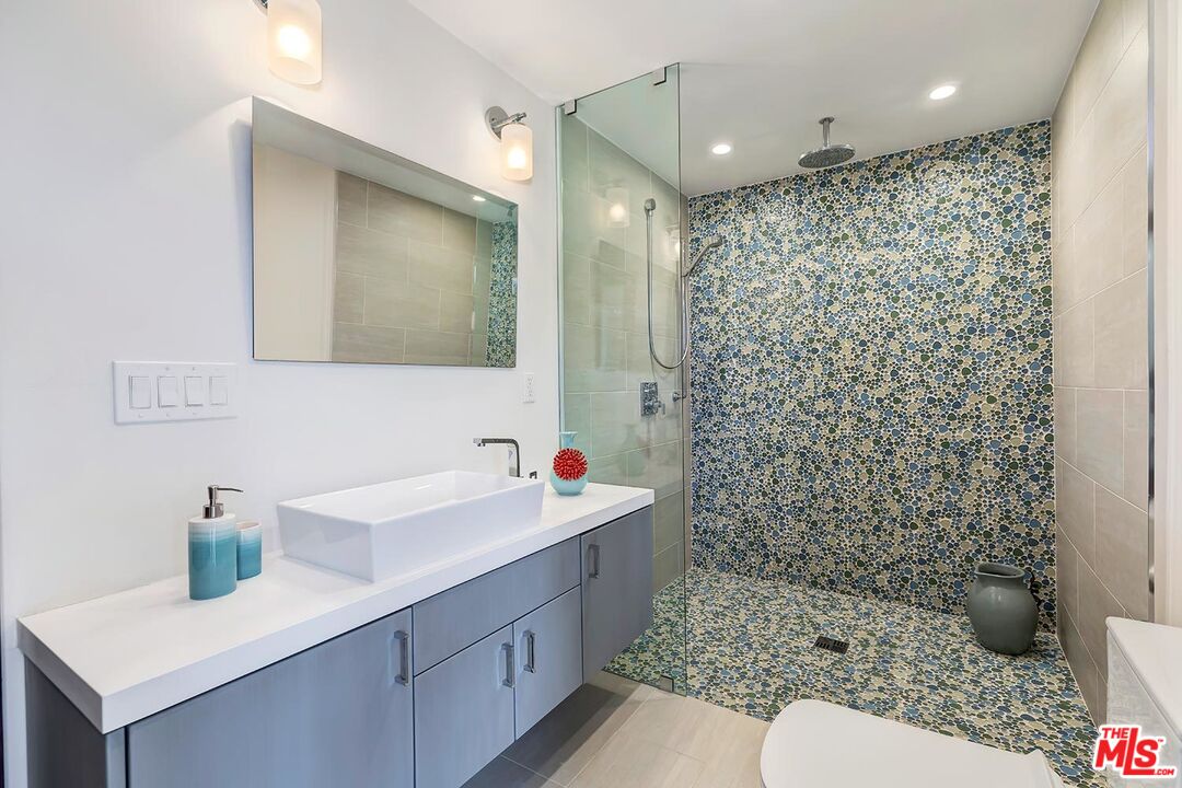 13146 Rivers Road Los Angeles, CA 90049 - Photo 20 of 38 a bathroom with a sink toilet and shower