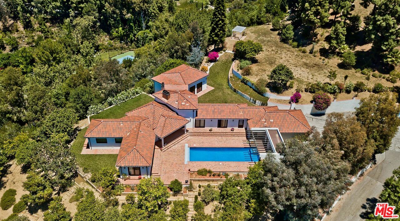 13146 Rivers Road Los Angeles, CA 90049 - Photo 2 of 38 an aerial view of multiple houses with yard