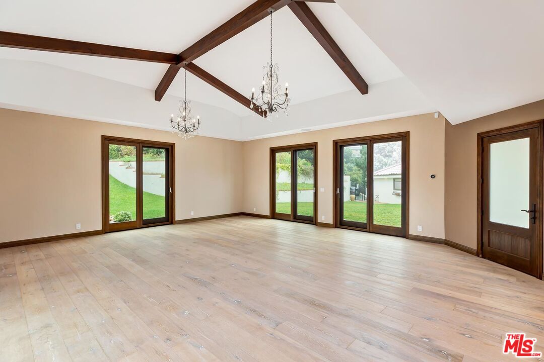 13146 Rivers Road Los Angeles, CA 90049 - Photo 22 of 38 a view of an empty room with window and hardwood floor
