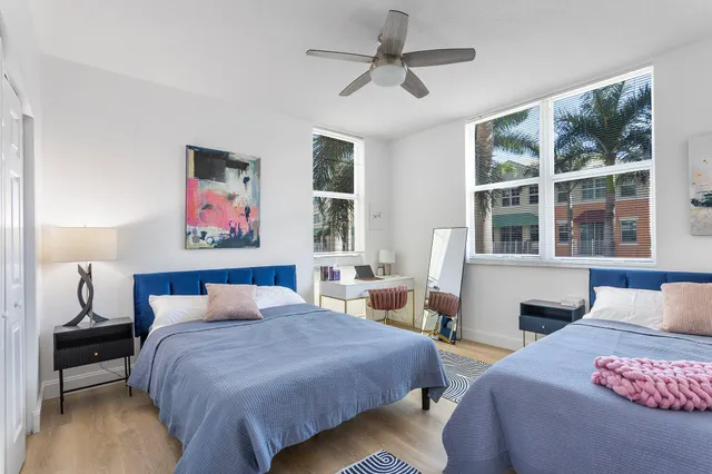 a bedroom with bed and window