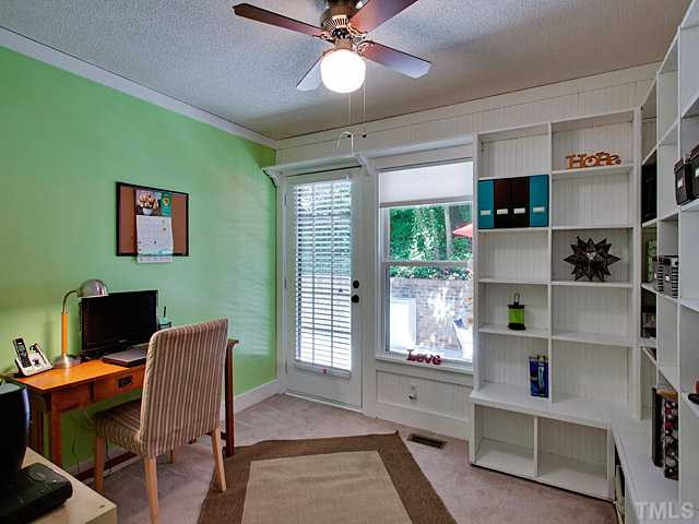 3623 Swann Street Raleigh, NC 27612 - Photo 14 of 22 This bedroom with built-ins is being used as a home office. Bedroom