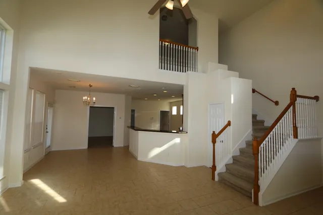 a view of a hallway view with staircase