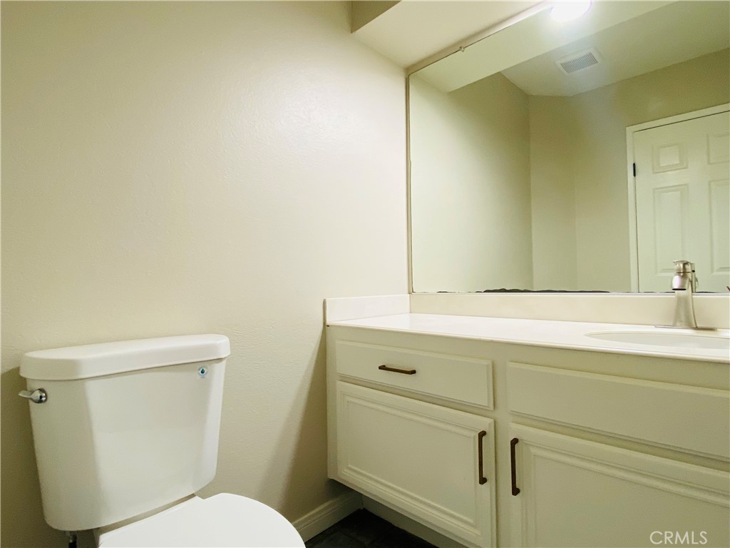 30 Mountain Shadows Place Pomona, CA 91766 - Photo 12 of 23 a bathroom with a toilet sink and mirror