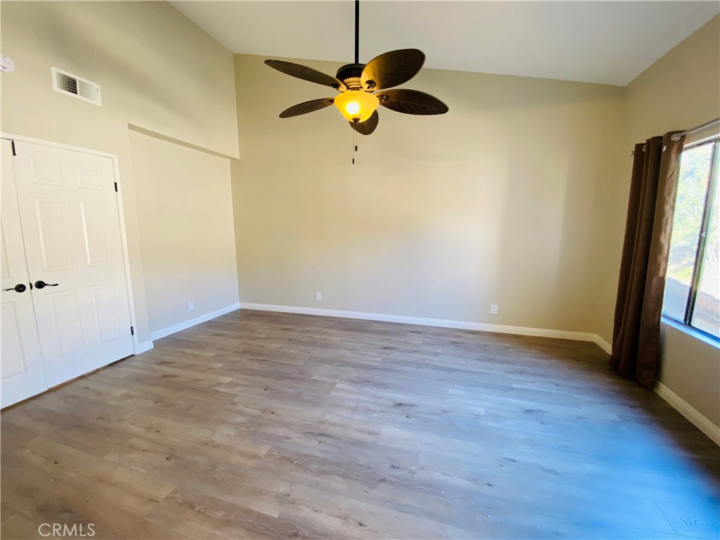 30 Mountain Shadows Place Pomona, CA 91766 - Photo 18 of 23 a view of an empty room with wooden floor and a window