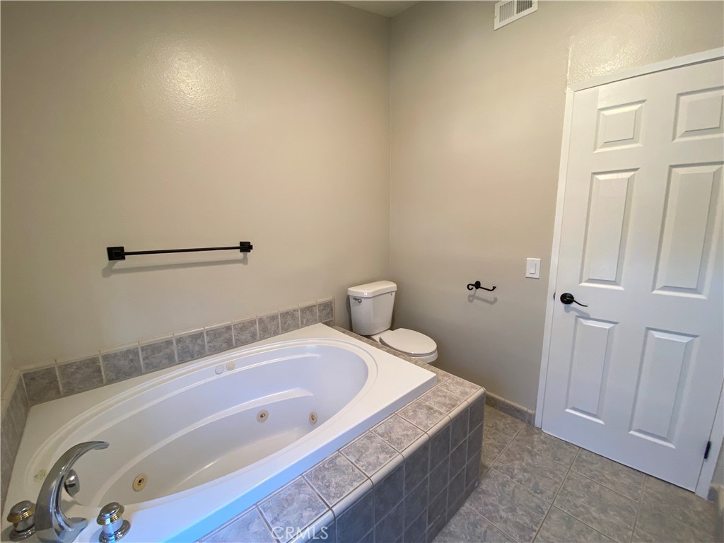 30 Mountain Shadows Place Pomona, CA 91766 - Photo 22 of 23 a bathroom with a tub and sink