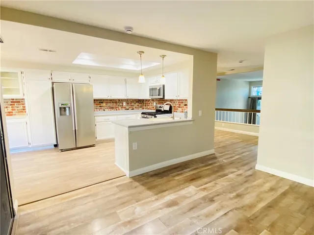 a view of a kitchen with a sink