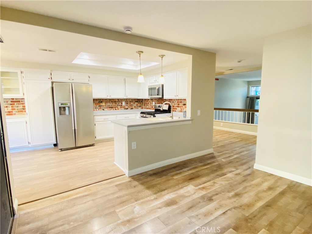 30 Mountain Shadows Place Pomona, CA 91766 - Photo 8 of 23 a view of a kitchen with a sink