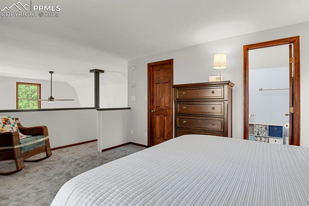 164 Aspen Circle Divide, CO 80814 - Photo 25 of 46 a bedroom with a bed and a dresser