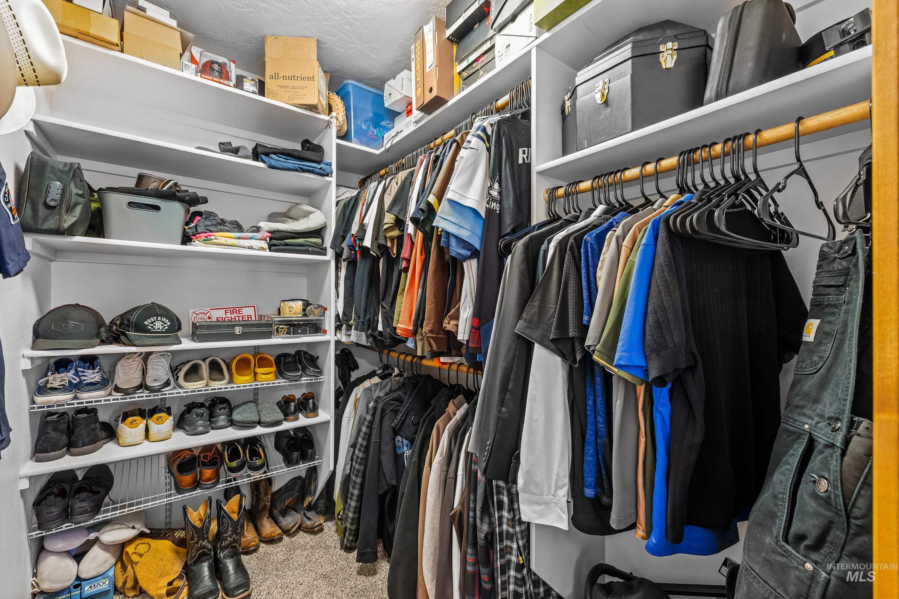 92 Cruickshank Road Horseshoe Bend, ID 83629 - Photo 25 of 50 Custom closet system with multiple shelving units, hanging rods, and integrated shoe racks