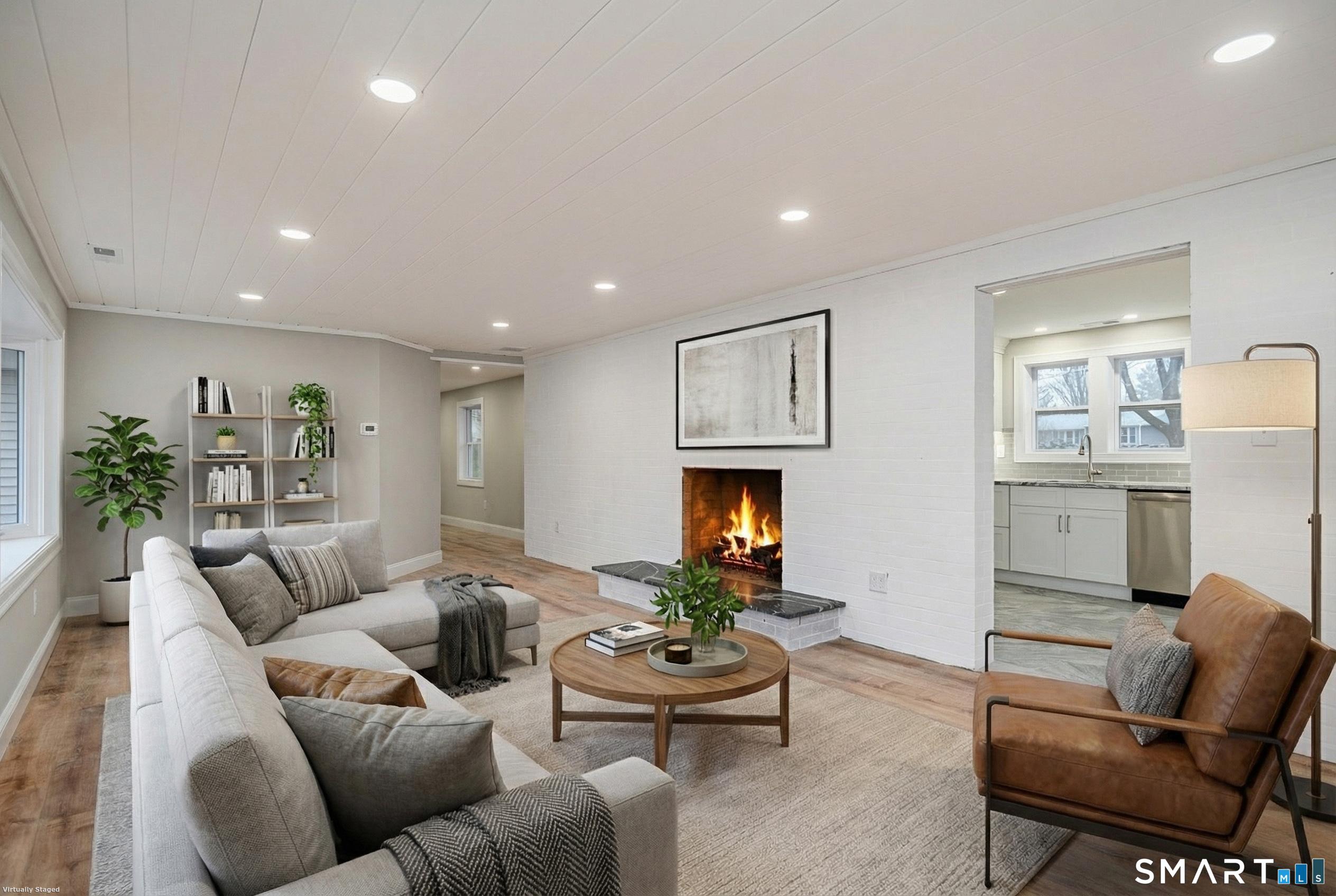 284 Chestnut Tree Hill Road Oxford, CT 06478 - Photo 12 of 34 a living room with furniture and a fireplace