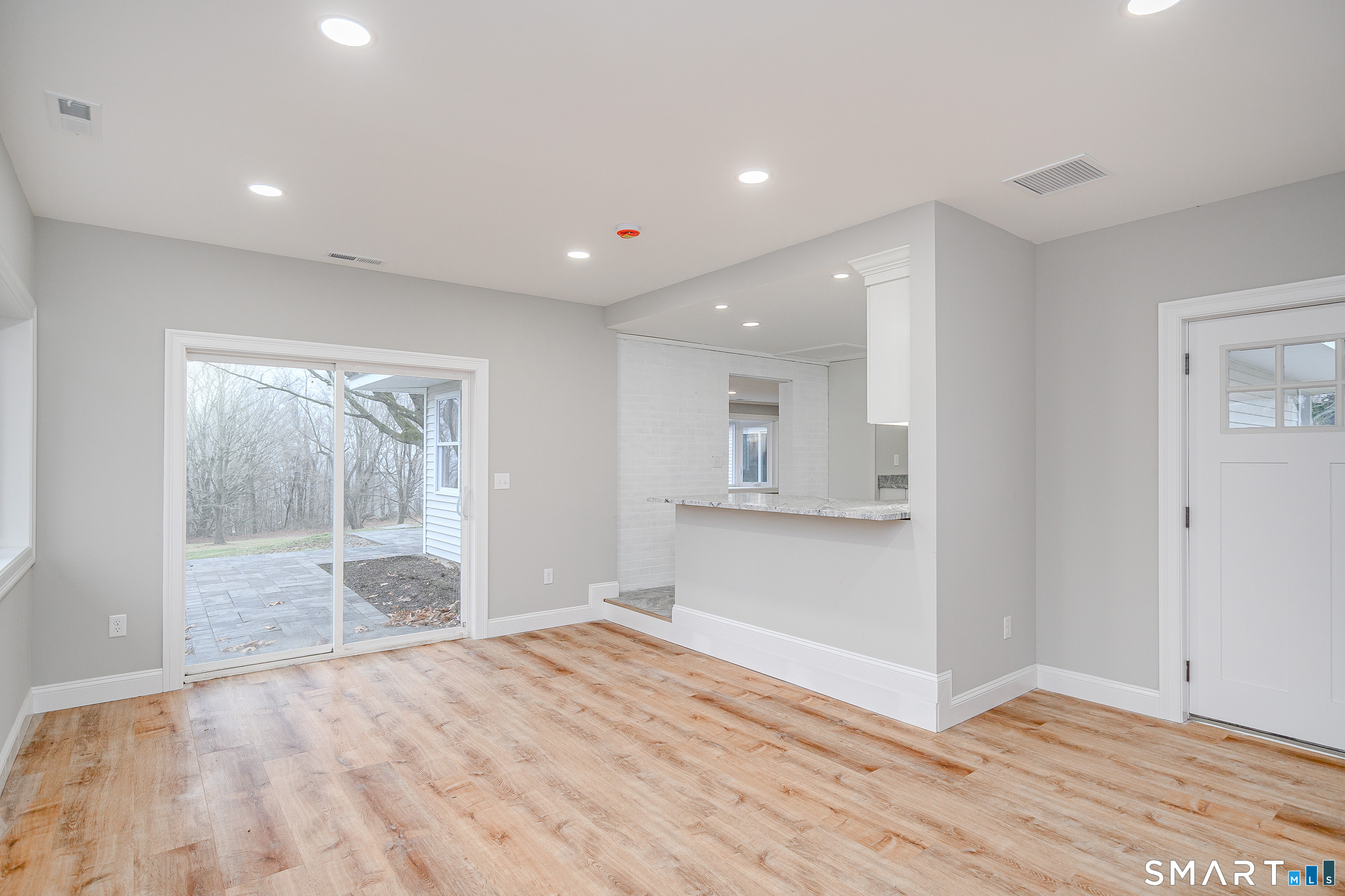 284 Chestnut Tree Hill Road Oxford, CT 06478 - Photo 8 of 34 a view of empty room with wooden floor and fan