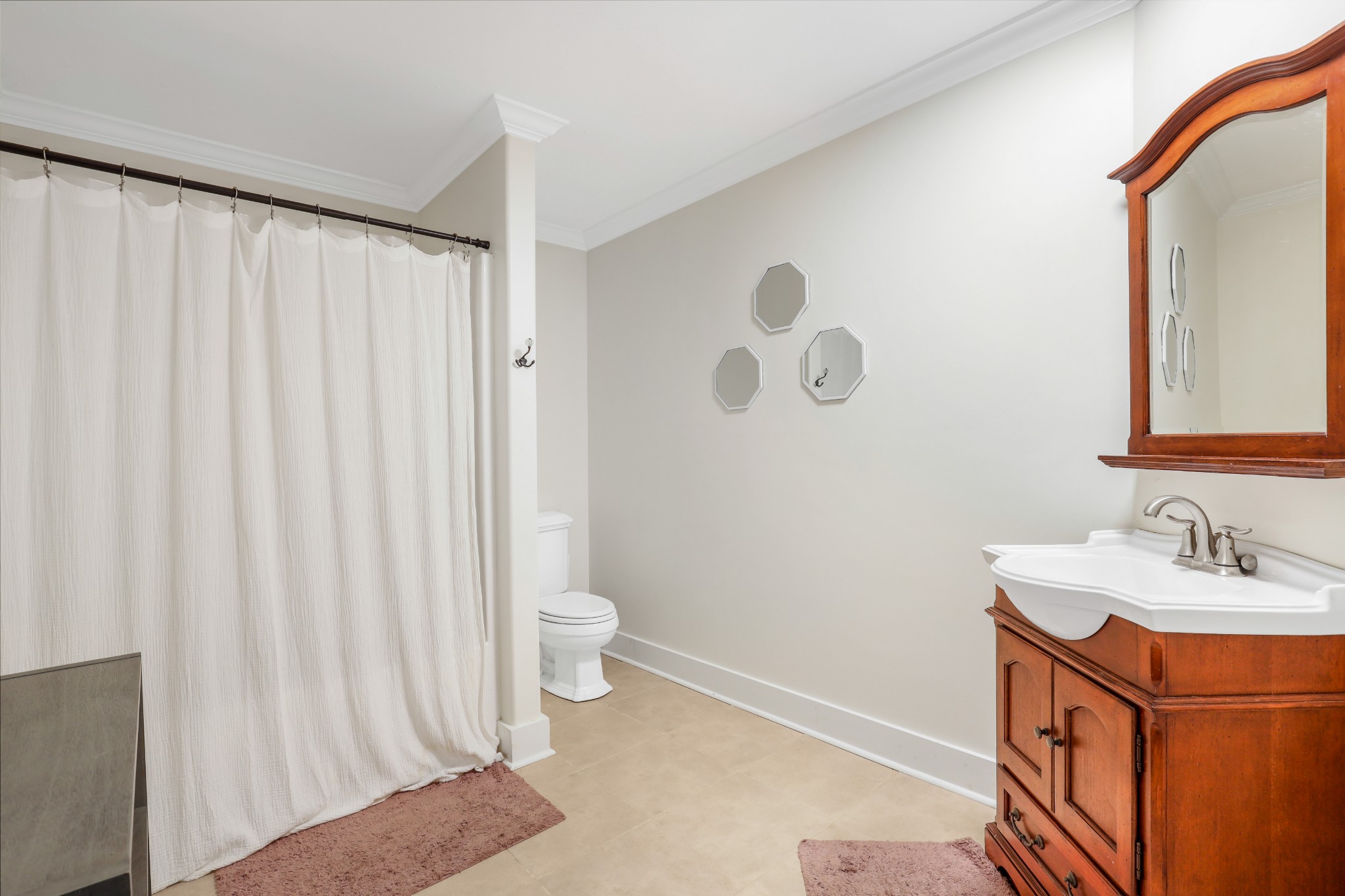 7518 Highway 49 Springfield, TN 37172 - Photo 21 of 35 a bathroom with a sink a toilet and shower curtain