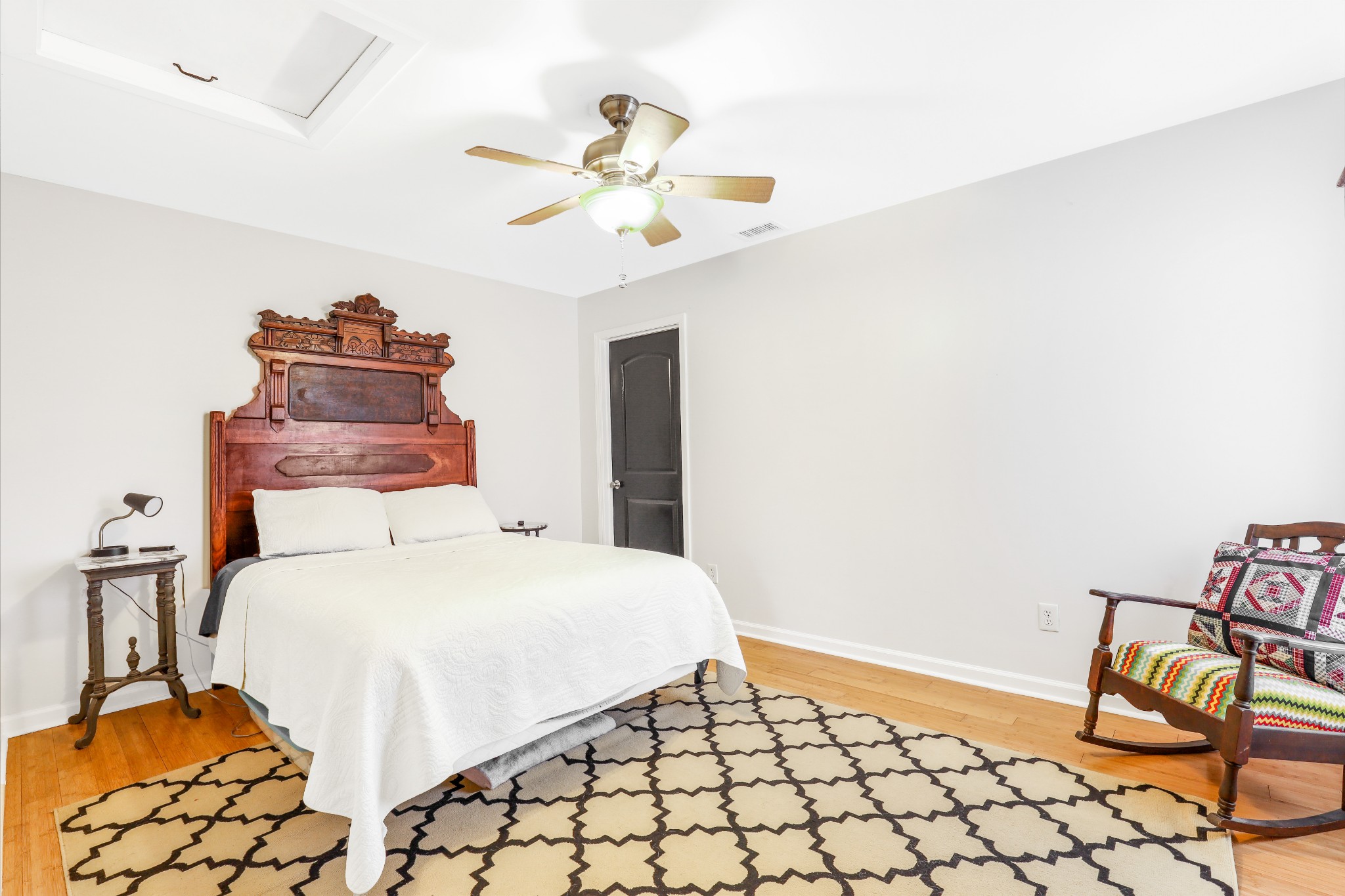 7518 Highway 49 Springfield, TN 37172 - Photo 22 of 35 a bedroom with a bed and a chandelier