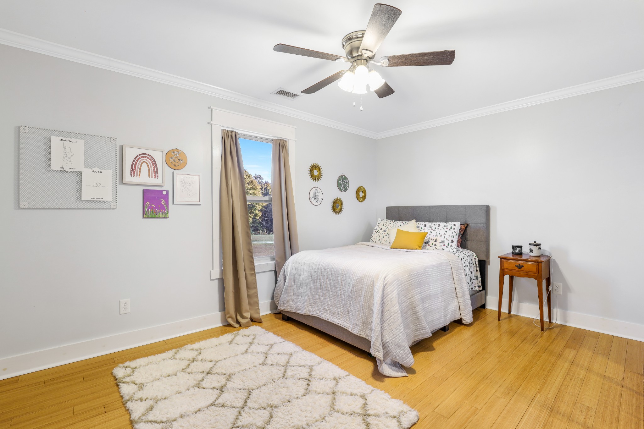 7518 Highway 49 Springfield, TN 37172 - Photo 23 of 35 a bedroom with a bed and a chandelier